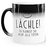 MoonWorks® Zaubertasse Farbwechsel Tasse lustiger Spruch lächle du kannst sie nicht alle töten Smiley Bürotasse weiß Magic-T